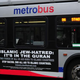 A Metro bus, featuring a controversial American Freedom Defense Initiative ad, on a street in Washington, D.C., May 21, 2014
KAREN BLEIER/Getty Images